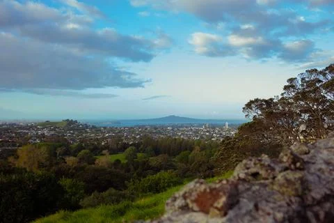 Sun setting into the horizon. The view is from high ground green mountain Stock-Fotos