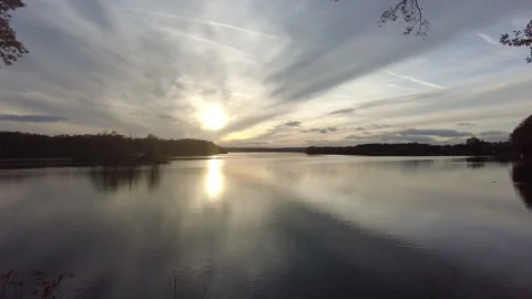 The sun setting on lake 'Spolsky Potok' in Třeboň, the Czech Republic Stock Footage 229802511