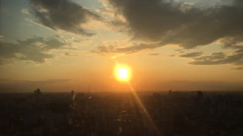 Sun setting in Moscow against clouds Stock Footage 251066103