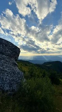 Sun setting in the mountains Stock Photos