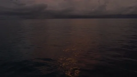 Sun setting on the ocean Stock Footage 80242249