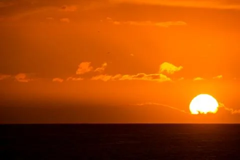 Sun Setting on the Ocean Stock Photos