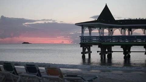 Sun setting over beach balcony Stock Footage 260578376