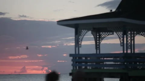 Sun setting over beach balcony Stock Footage 260578383