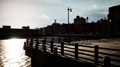 The sun is setting over a body of water Stock Illustration