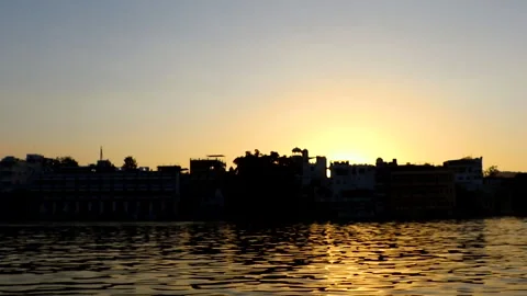 Sun setting over buildings in Udaipur, India Stock Footage 289620518