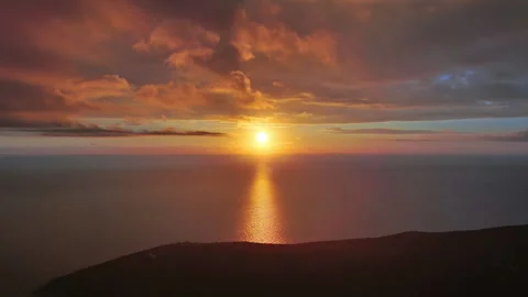 Sun setting over calm sea natural landscape Stock Footage 345443280