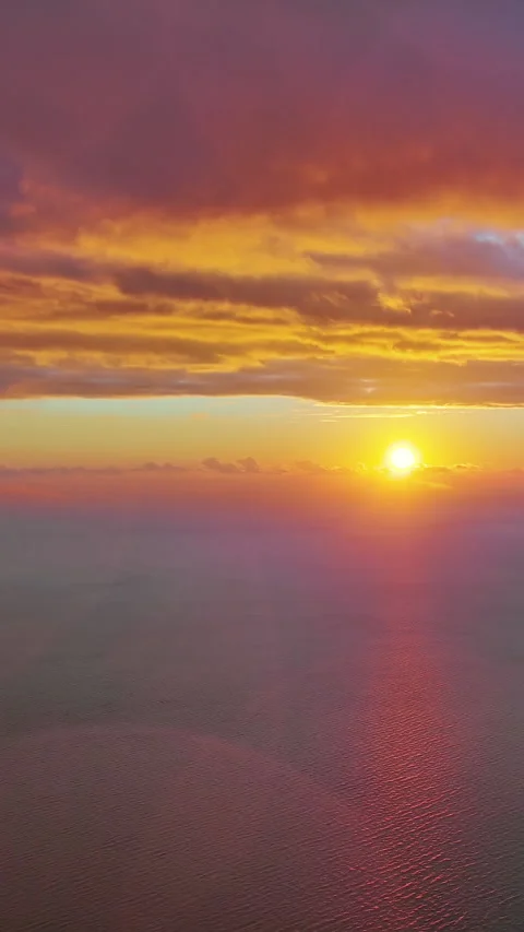 Sun setting over calm sea natural landscape Stock Footage 346654511