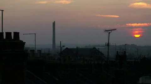 Sun Setting over city rooftops Stock Footage 10811825