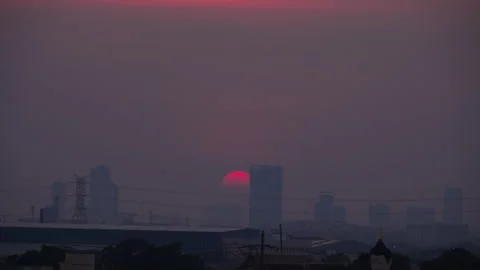 Sun setting over city skyline Stock Footage 274361716