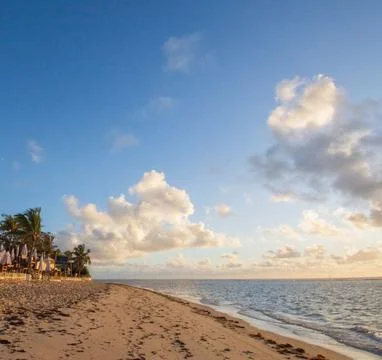 Sun Setting Over an Empty Beach Stock Photos