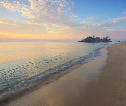 Sun Setting Over an Empty Beach Stock Photos
