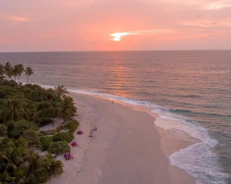 Sun Setting Over an Empty Beach Stock Photos