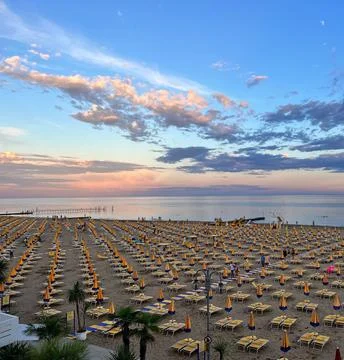 Sun Setting Over an Empty Beach Stock Photos