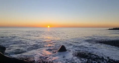 Sun Setting Over an Empty Sandy Beach Stock Footage 346457270
