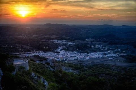 Sun setting over Es Mercadal, Spain Foto stock