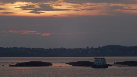 Sun setting over fish farm on the ocean, 4k Stock Footage 111931759