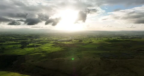 Sun setting over green valley in North Yorkshire Stock Footage 276143142