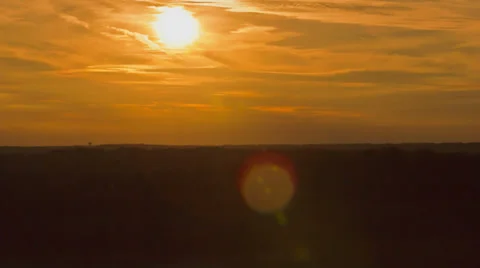 Sun setting over the horizon - 4K Ultra HD time lapse Video stock 35328985