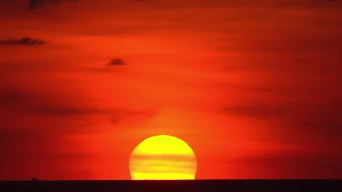 Sun setting over horizon Stock Footage 270373209