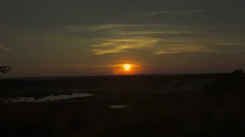 Sun setting over the horizon - Time lapsed Stock Footage 29656154