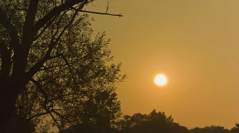 Sun setting over the horizon - Time lapsed Stock Footage 29656244