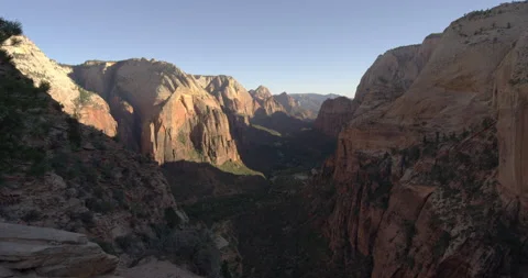 Sun setting over huge mountains and a valley in Utah Stock Footage 146123059
