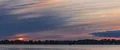 Sun Setting Over The Lake And Behind The Trees - Anamorphic Timelapse 4k or 4k+ Resolution