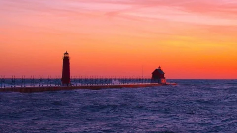Sun Setting Over Lake Michigan's Grand Haven Lighthouse Stock Footage 115846901