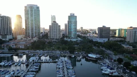 Sun setting over marina and buildings  St. Petersbrurg, Florida Stock Footage 337072748