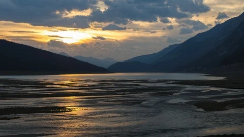 Sun setting over medicine lake 4K Stock Footage 107956964