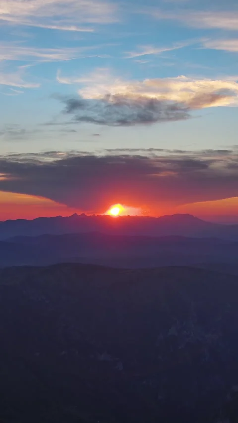 Sun setting over mountain with dramatic clouds. Evening sky at sunset. Durmitor Stock Footage 339225288