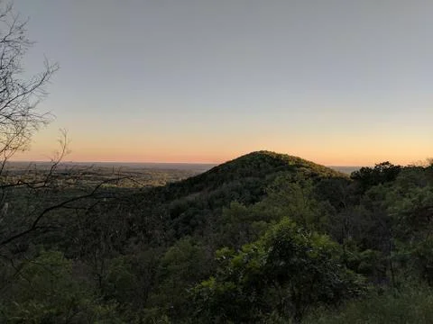 Sun Setting Over the Mountain Stock Photos