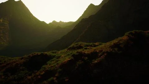 The sun is setting over a mountain range Stock Illustration