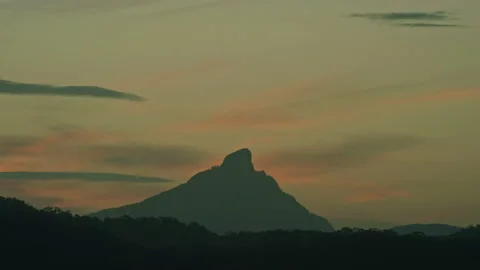 Sun setting over Mt Warning sacred aboriginal location in Australia Stock Footage 153232113