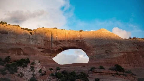 Sun Setting over Natural Arch Stock Footage 70007161