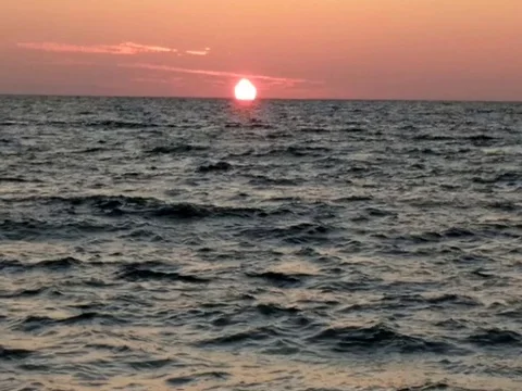 The Sun Setting over the Ocean 1 of 4 Stock Footage 80724785