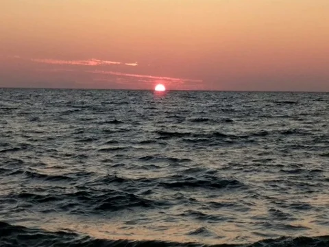 The Sun Setting over the Ocean 3 of 4 Stock Footage 80724910