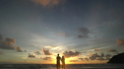 The sun is setting over the ocean, casting a warm glow over the water Stock Footage 313555662