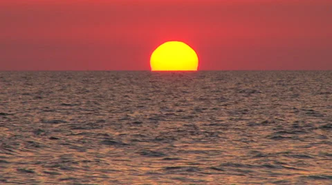 Sun setting over the ocean Stock Footage 38322518
