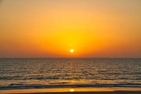 Sun Setting Over the Ocean Stock Photos