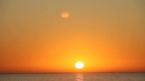 Sun setting over the ocean waters Stock Footage 123200995