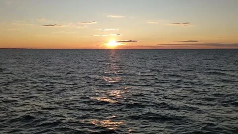Sun Setting Over the Open Ocean Video stock 256875126