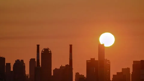 Sun setting over a power generating station in LIC NYC Stock Footage 341362467