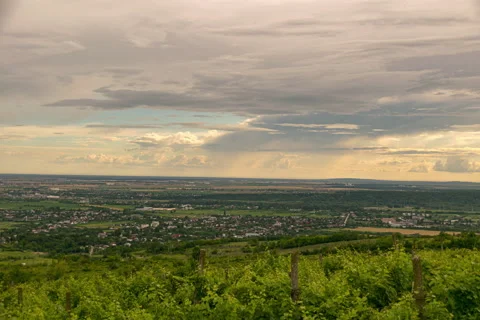 Sun setting over rural zone. Rain clouds moving Stock Footage 133315485