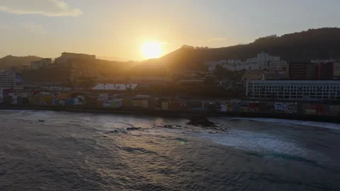Sun setting over San Cristobal fishing district in Las Palmas de Gran Canaria Stock Footage 313299246