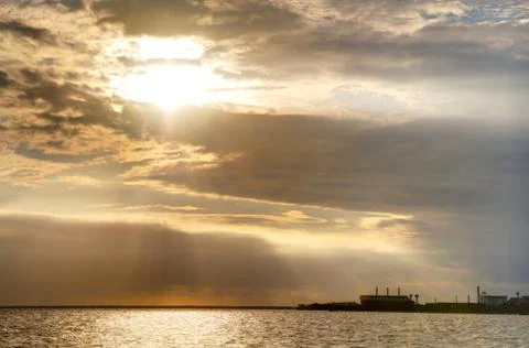 Sun Setting Over the Sea Stock Photos