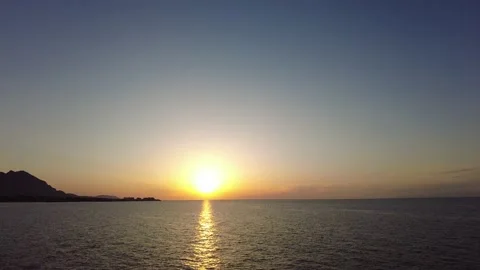 The sun is setting over the sea on the tropical island. Stock Footage 219698216