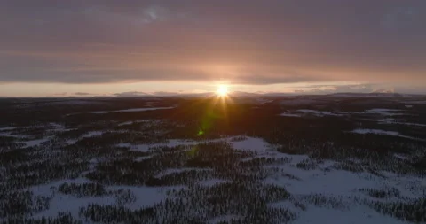 Sun setting over Swedish Lapland Stock Footage 220025693