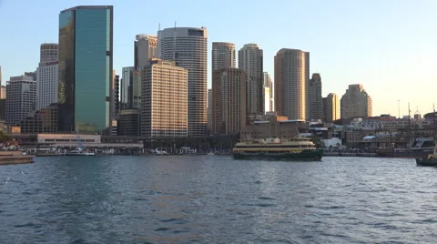 Sun setting over Sydney CBD as ferry departs Stock Footage 52877861